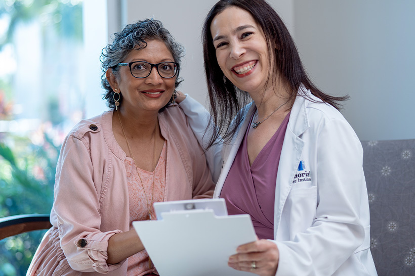 Tammy Adar, MS, LCGC, manager of the Genetic Counselor program, meets with patient, Zeena.
