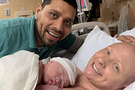 Christina and husband in delivery room with newborn baby
